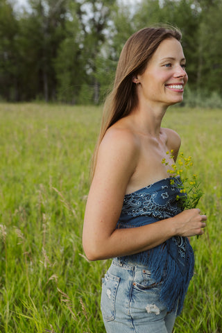 Founder of Fatskn Inc. Caitlin Warrington smiling in a pasture.