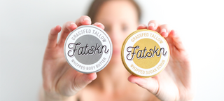 Caitlin Warrington holding two Fatskn grassfed tallow whipped body butter tins.